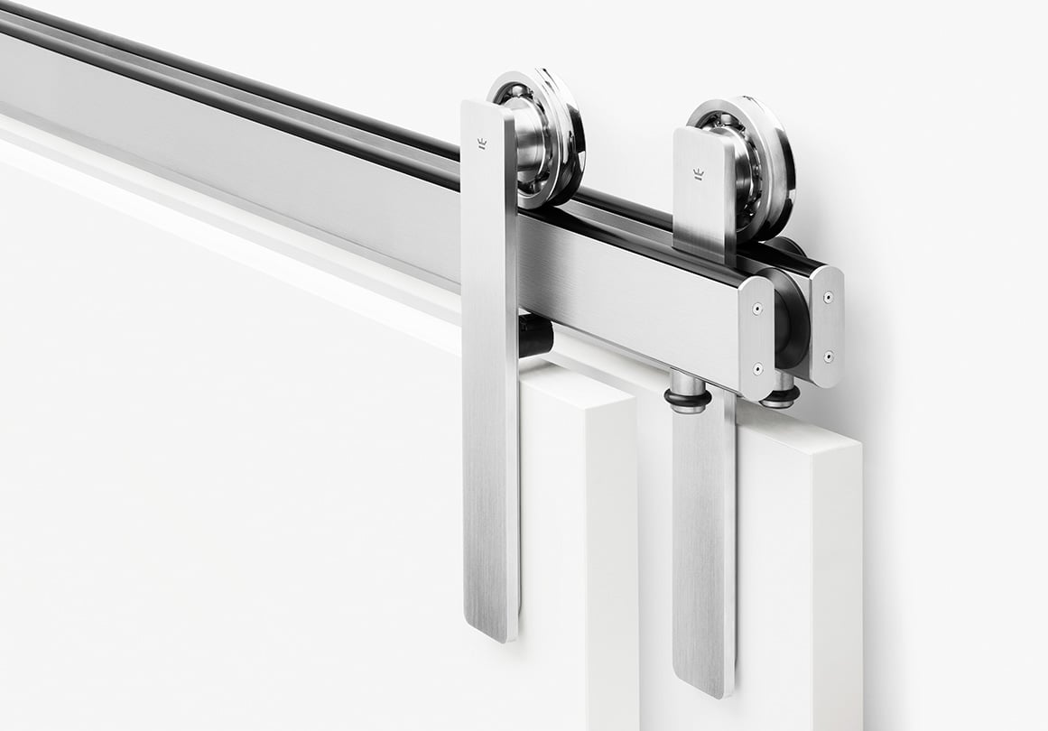 Oden sliding door hardware system in bypass configuration and Brushed Stainless finish.